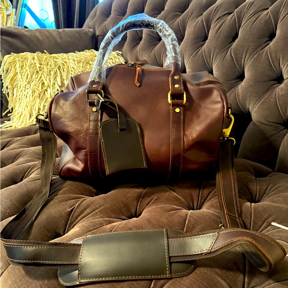 Brand New never used brown leather overnite bag.